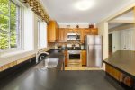Open Kitchen with Stainless Steel Appliances